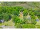 Aerial view of the property shows it nestled among trees and near a marsh at 7239 Commodore Rd, Hollywood, SC 29449