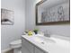 Cozy bathroom featuring modern fixtures, framed mirror, decorative artwork, and a vanity with sink at 7239 Commodore Rd, Hollywood, SC 29449