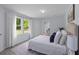 Sunlit main bedroom with neutral decor, carpet, and backyard views at 7239 Commodore Rd, Hollywood, SC 29449