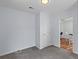 Neutral bedroom with gray carpet and a view to a dining area, offering a versatile space at 7239 Commodore Rd, Hollywood, SC 29449