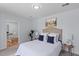 Comfortable bedroom with large bed, plush pillows, and views to an adjacent eat-in kitchen at 7239 Commodore Rd, Hollywood, SC 29449