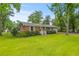Charming brick home with well-maintained front yard and inviting white porch at 7239 Commodore Rd, Hollywood, SC 29449