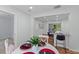 Bright eat-in kitchen adjacent to the dining room, with granite countertops and stainless appliances at 7239 Commodore Rd, Hollywood, SC 29449