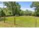 Spacious fenced lot features lush greenery and potential for various outdoor activities at 7239 Commodore Rd, Hollywood, SC 29449