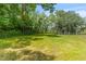 Expansive fenced lot with lush greenery and mature trees, perfect for recreation at 7239 Commodore Rd, Hollywood, SC 29449
