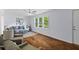 Bright and airy living room features large windows and neutral decor at 7239 Commodore Rd, Hollywood, SC 29449