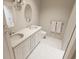 Bright bathroom featuring double sinks, a large mirror, and modern fixtures, offering a clean and stylish space at 7622 Indigo Palms Way, Johns Island, SC 29455
