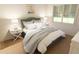 Cozy bedroom with a comfortable bed, side tables, and natural light from the window at 7622 Indigo Palms Way, Johns Island, SC 29455
