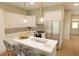 Modern kitchen with stainless steel appliances, ample counter space, and stylish pendant lighting at 7622 Indigo Palms Way, Johns Island, SC 29455
