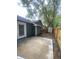 The backyard features a large concrete patio and is surrounded by a wooden privacy fence at 8254 Timberidge Ct, North Charleston, SC 29420