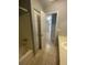 The bathroom features tile flooring and includes a large closet for storage at 8254 Timberidge Ct, North Charleston, SC 29420