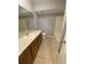 This bathroom offers a long vanity with ample storage, a toilet and tub with shower at 8254 Timberidge Ct, North Charleston, SC 29420