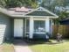 Inviting exterior of home with fresh paint, manicured landscaping, and a charming bay window at 8254 Timberidge Ct, North Charleston, SC 29420