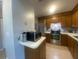 Efficient kitchen features stainless steel appliances, tile floors, and ample cabinet storage at 8254 Timberidge Ct, North Charleston, SC 29420