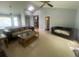 Bright and airy living room with tile floors, vaulted ceilings, and plenty of natural light at 8254 Timberidge Ct, North Charleston, SC 29420