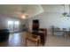 Spacious living room featuring tile floors, neutral paint, fireplace, ceiling fans, and outdoor access at 8254 Timberidge Ct, North Charleston, SC 29420