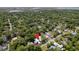 Aerial view of a large modern home with a pool and a marker of its location in a green tree-filled neighborhood at 931 Kincade Dr, Mount Pleasant, SC 29464