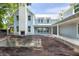 View of the backyard of a large home with a chimney with a fireplace and a concrete pool being built at 931 Kincade Dr, Mount Pleasant, SC 29464