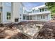 The backyard of a multi-story home with a concrete pool being built and a chimney with a fireplace at 931 Kincade Dr, Mount Pleasant, SC 29464