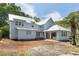Home with white siding and a bright metal roof with freshly prepped landscaping at 931 Kincade Dr, Mount Pleasant, SC 29464