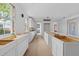 Kitchen with white cabinets, hardwood floors, windows, and a view of the outdoor scenery at 931 Kincade Dr, Mount Pleasant, SC 29464