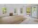 Bright living room features wood floors, big windows, and sliding glass doors to the backyard at 931 Kincade Dr, Mount Pleasant, SC 29464