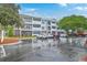 Exterior of a three-story apartment building with ample parking on a cloudy day at 1025 Riverland Woods Pl # 904, Charleston, SC 29412