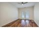 Bedroom with hardwood floors, ceiling fan, and glass patio doors offer bright natural lighting at 1025 Riverland Woods Pl # 904, Charleston, SC 29412