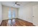 Bedroom with hardwood floors, ceiling fan, and glass patio doors offer bright natural lighting at 1025 Riverland Woods Pl # 904, Charleston, SC 29412