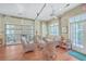 Comfortable lounge area with wicker furniture and natural light, perfect for relaxing at 1025 Riverland Woods Pl # 904, Charleston, SC 29412