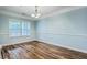 Bright dining room with hardwood floors, light-blue walls, and a chandelier, creating an inviting atmosphere for gatherings at 1025 Riverland Woods Pl # 904, Charleston, SC 29412