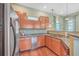 Well-lit kitchen featuring granite countertops, wood floors, and stainless steel appliances at 1025 Riverland Woods Pl # 904, Charleston, SC 29412