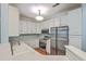 Contemporary kitchen featuring white cabinets, stainless steel appliances, and a dual sink for efficient cooking and cleaning at 1025 Riverland Woods Pl # 904, Charleston, SC 29412