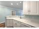 Bright kitchen featuring white cabinets, countertop bar, and modern appliances at 1025 Riverland Woods Pl # 904, Charleston, SC 29412