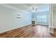 Inviting living room with hardwood floors, fireplace, light-blue walls, and large windows creating a cozy and bright atmosphere at 1025 Riverland Woods Pl # 904, Charleston, SC 29412