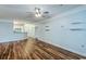 Open-concept living room showcasing hardwood floors, light-blue walls, and a kitchen view for a functional layout at 1025 Riverland Woods Pl # 904, Charleston, SC 29412