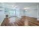 Bright living room showcasing hardwood floors, fireplace, and light-blue walls with large windows for natural light at 1025 Riverland Woods Pl # 904, Charleston, SC 29412
