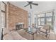 Covered patio area with a stone fireplace and seating, providing a cozy outdoor space at 1025 Riverland Woods Pl # 904, Charleston, SC 29412