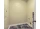 Compact utility room with tile floors and trim offers space for laundry at 1025 Riverland Woods Pl # 904, Charleston, SC 29412