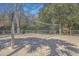 Community sand volleyball court surrounded by mature trees at 1025 Riverland Woods Pl # 904, Charleston, SC 29412