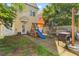 Backyard featuring a wooden playground, seating area, and partial white fence at 104 Hyacinth St, Summerville, SC 29483