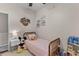 Comfortable bedroom featuring hardwood floors, a bed, and light filled decor shelving at 104 Hyacinth St, Summerville, SC 29483