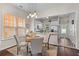 Bright dining area featuring stylish pendant lighting and seamless connection to the modern kitchen at 104 Hyacinth St, Summerville, SC 29483