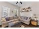 Comfortable living room with large windows, an expansive sectional sofa, and stylish decor at 104 Hyacinth St, Summerville, SC 29483