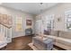 Inviting living room features hardwood floors, large windows, and a cozy seating area with stylish decor at 104 Hyacinth St, Summerville, SC 29483