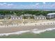 Stunning aerial view shows easy beach access, refreshing pool, and lush grounds at 9000 Palmetto Dr # C104, Isle of Palms, SC 29451