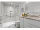 Modern bathroom featuring a walk-in shower, granite vanity, and a stylish mirror at 9000 Palmetto Dr # C104, Isle of Palms, SC 29451
