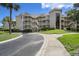 Exterior of building features a balcony and staircase at 9000 Palmetto Dr # C104, Isle of Palms, SC 29451
