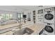Modern kitchen with granite countertops, stainless steel appliances, and stylish decor at 9000 Palmetto Dr # C104, Isle of Palms, SC 29451