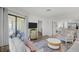 Comfortable living room with access to a screened-in porch and an open floor plan at 9000 Palmetto Dr # C104, Isle of Palms, SC 29451